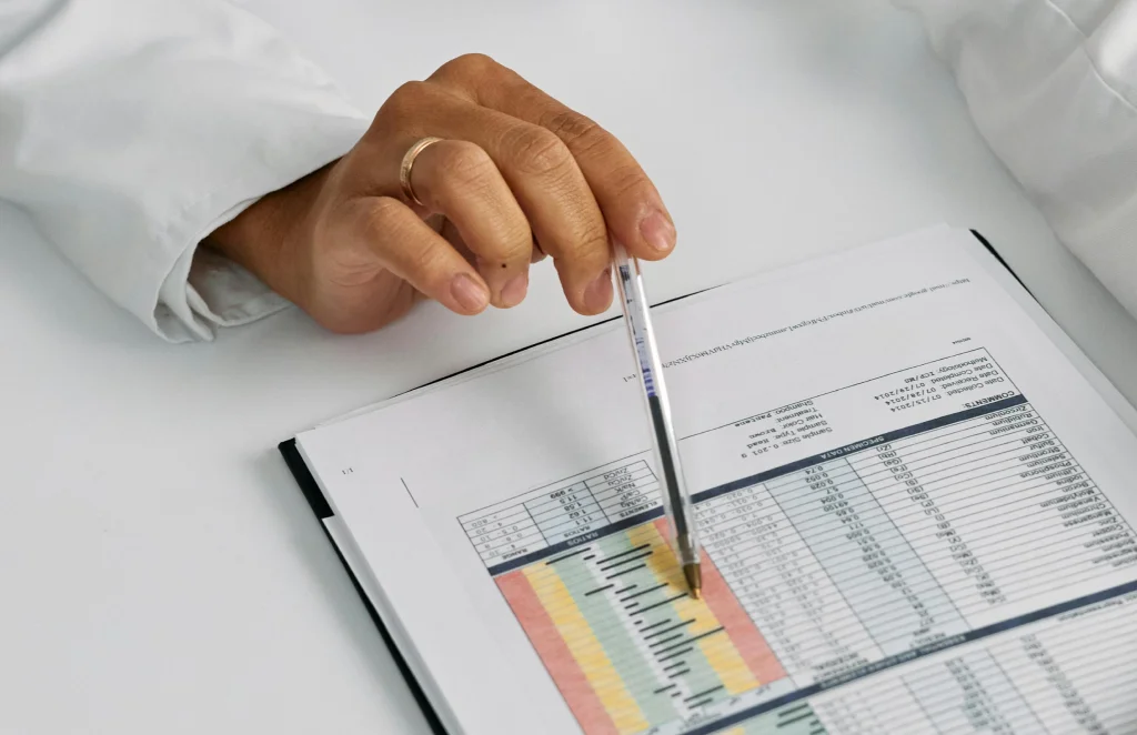 Person trying to evaluate costs on his tablet.